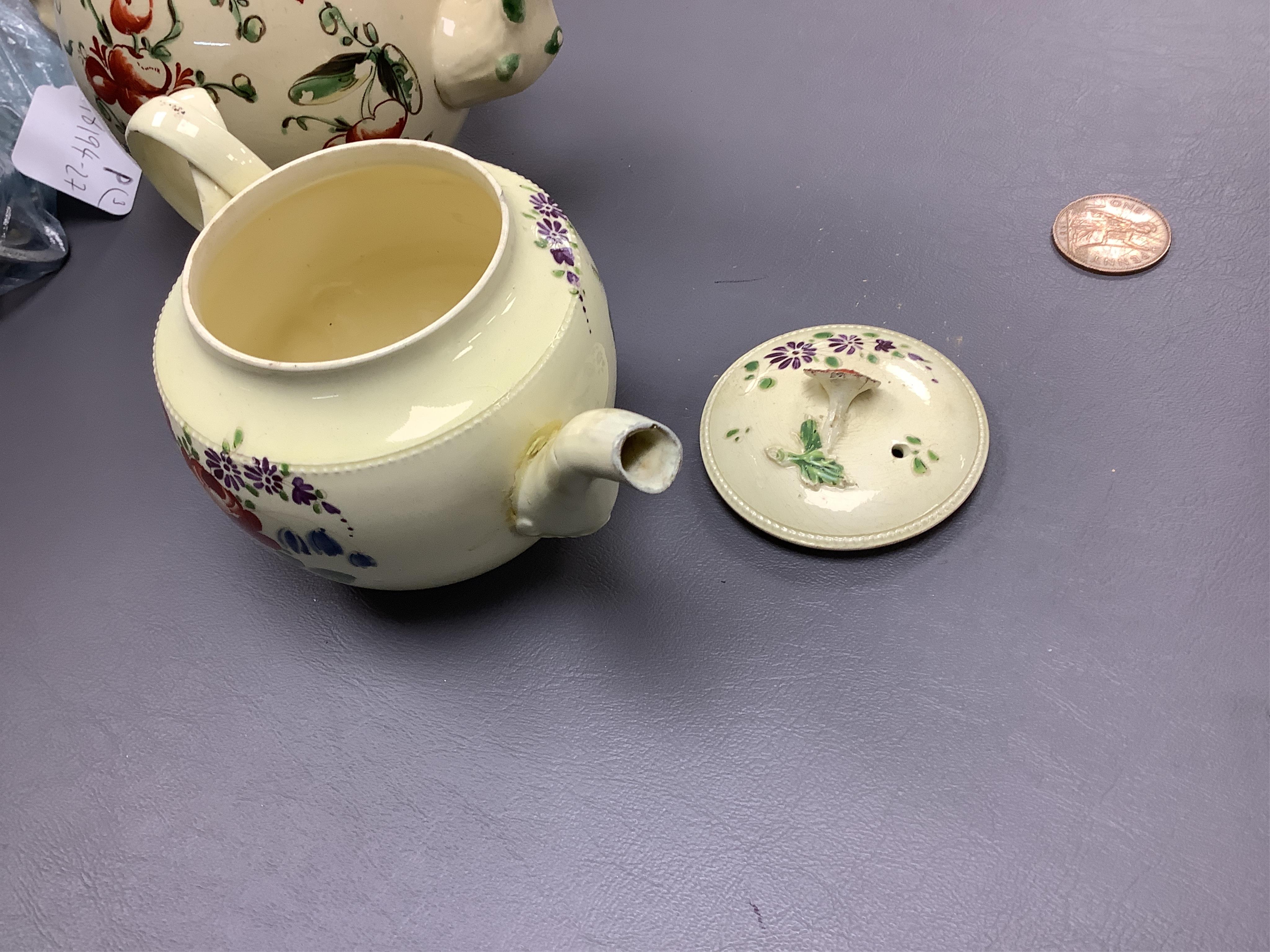 Two George III creamware teapots and a lidded sugar bowl, c.1780, largest 20cm wide